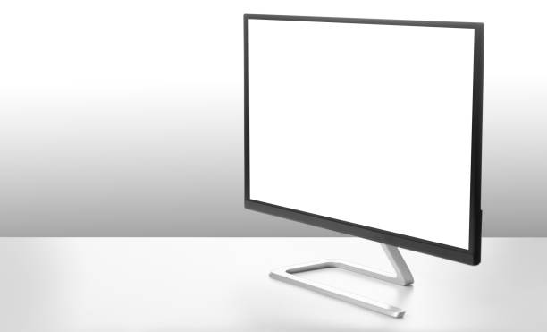 istock Modern monitor on white table and light background. 1195792794