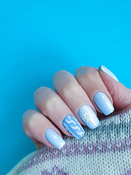 istock female hand nail beautiful manicure sweater 1195797000