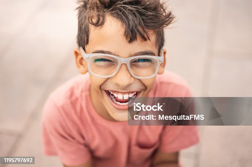 istock Happy boy laughing outdoors 1195797692