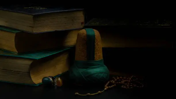 rumi hat and old books, whirling dervish