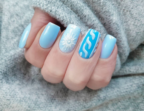 istock female hand nail beautiful manicure sweater 1195797884