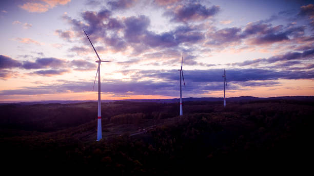 istock Droneview - Windmills in the sunset 1195801630