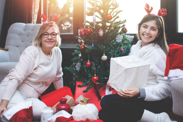 istock Celebrating Christmas, decorating the christmas tree 1195804800