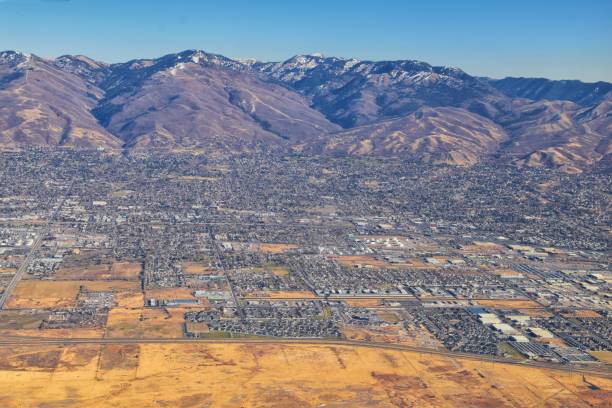 istock Wasatch Front Rocky Mountain Range Aerial view from airplane in fall including urban cities and the Great Salt Lake around Salt Lake City, Utah, United States of America. USA. 1195805517