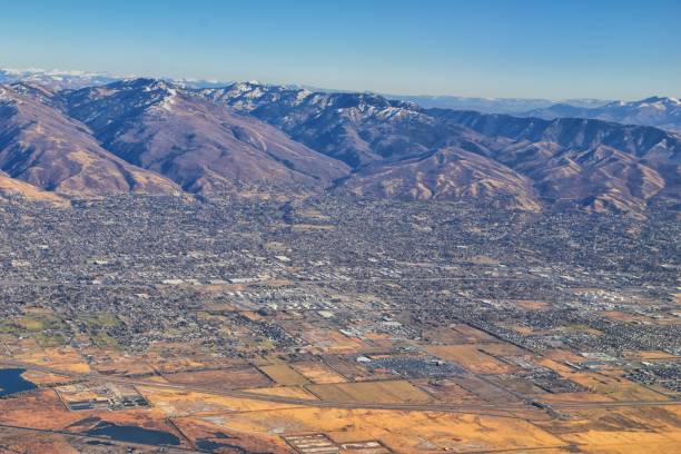 istock Wasatch Front Rocky Mountain Range Aerial view from airplane in fall including urban cities and the Great Salt Lake around Salt Lake City, Utah, United States of America. USA. 1195805555