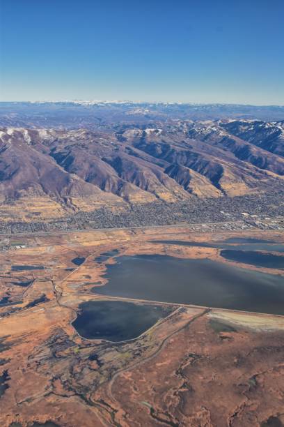 istock Wasatch Front Rocky Mountain Range Aerial view from airplane in fall including urban cities and the Great Salt Lake around Salt Lake City, Utah, United States of America. USA. 1195806155