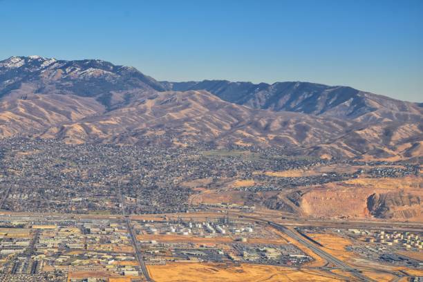 istock Wasatch Front Rocky Mountain Range Aerial view from airplane in fall including urban cities and the Great Salt Lake around Salt Lake City, Utah, United States of America. USA. 1195806420