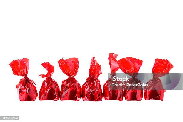 Red Luxury Sweets In A Row Isolated On White Stock Photo - Download Image Now - Candy, Color Image, Copy Space