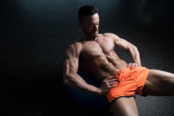 istock Exercising Abdominals On Exercise Ball 1195808199