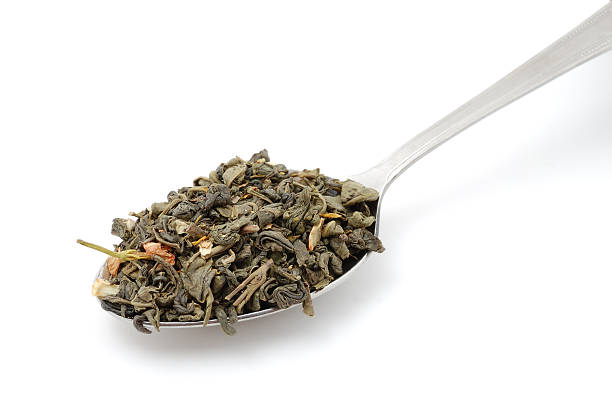 istock Dried green tea in metal spoon 119580947