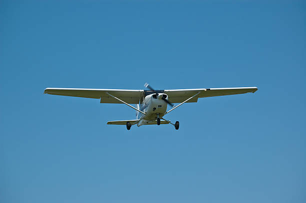 istock Small Aircraft in Flight with Blue Sky 119581235