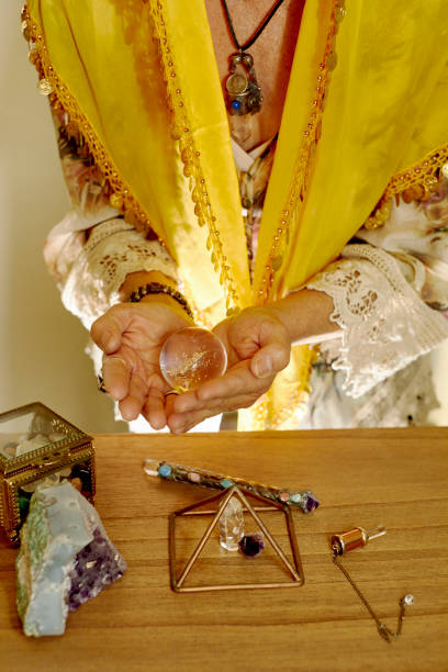 istock Psychic Reader holding a Crystal Ball 1195813324