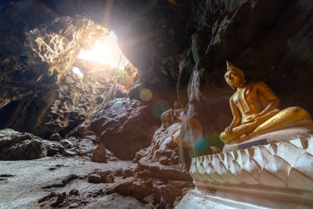 istock Buddha image with sun ray and lens flare 1195824121