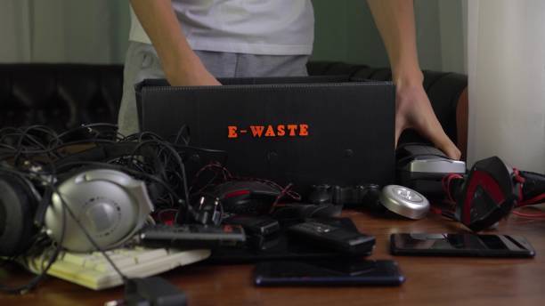 istock E-waste. Electronic waste. A man is sorting household defective and obsolete electronic equipment in box for recycling and disposal 1195827638