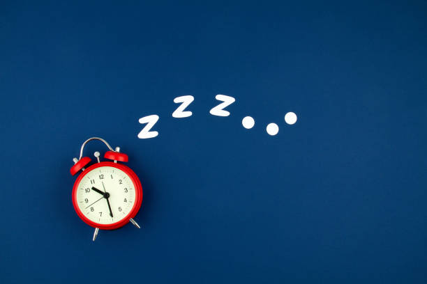 Snoring classic alarm clock on blue pastel trendy background. Flat lay, top view mock up Snoring classic alarm clock on blue pastel trendy background. Flat lay, top view mock up. Minimal concept of rest, quality of sleep, good night, insomnia, relaxation better sleep stock pictures, royalty-free photos & images