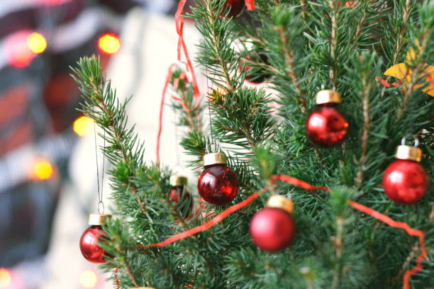 istock Christmas tree photo image. Glass red balls on a Christmas tree. 1195831205