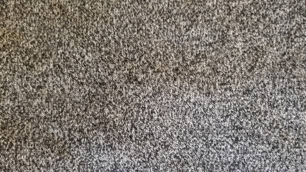 istock texture of black and white wool neat fabric 1195833974