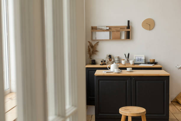 istock Entrance to light kitchen with served table and stool 1195835351