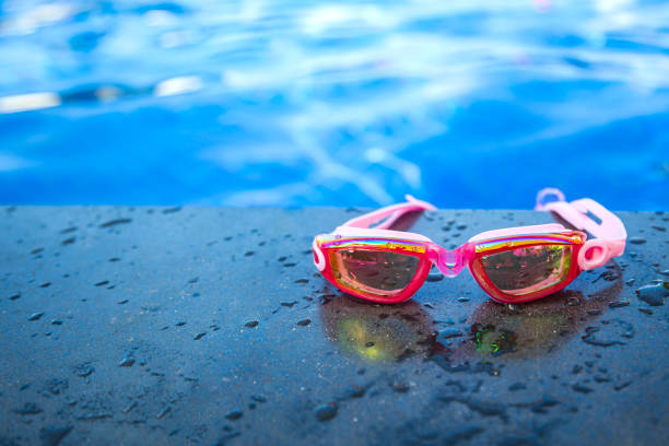 Blue swimming goggles with water droplets