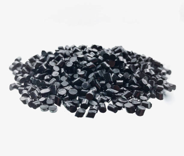 black plastic polymer granules Close-up of black plastic polymer granules on white background pvc photos stock pictures, royalty-free photos & images