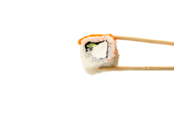 istock wooden sticks holds sushi on a clean white background 1195837579