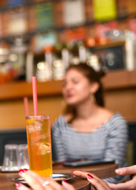 istock Group of Young People Socializing in a Cafe 1195838350
