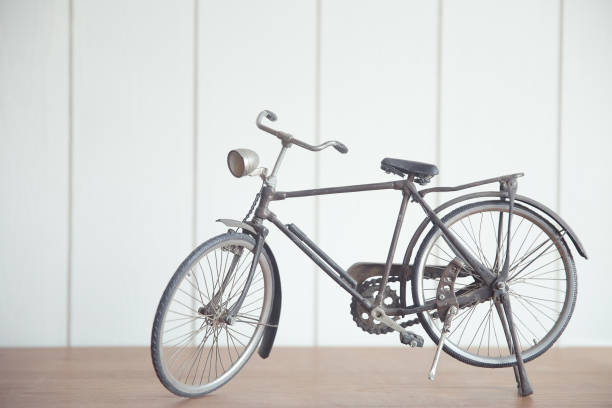 istock vintage model bicycle on a wood table 1195838481