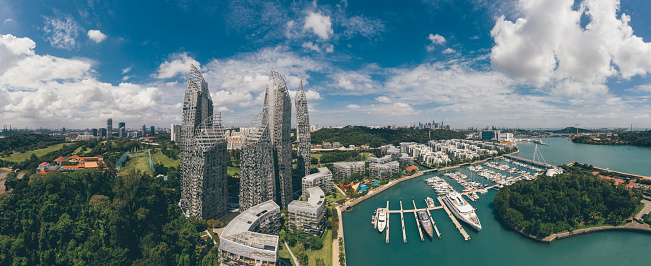 Modern and luxury smart homes in Singapore, seen from above during a hot summer day at the Keppel Bay Yacht Marina area in the city centre.