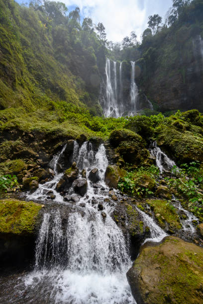 istock Inside the canyon of the Tumpak Sewu waterfall on Java Indonesia 1195839369