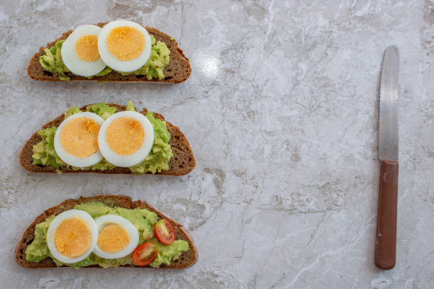 istock sliced avocado and egg on toasted bread 1195840711