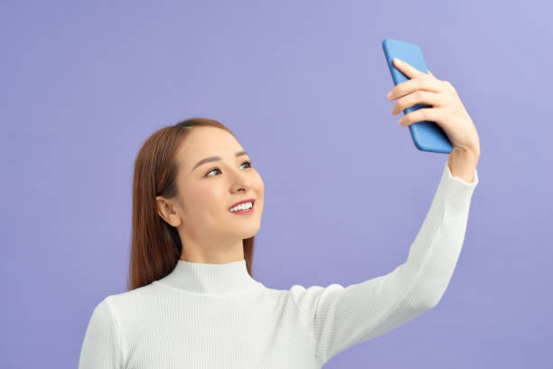 istock a beautiful girl taking selfie 1195842426