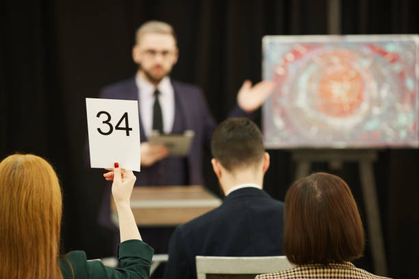 istock People sitting at auction 1195845091