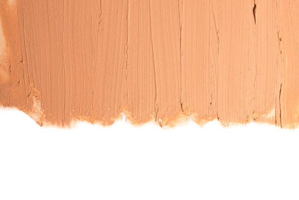 istock Liquid foundation texture. Make up for women. Top view. Isolated on white. Space for text or design. 1195849157