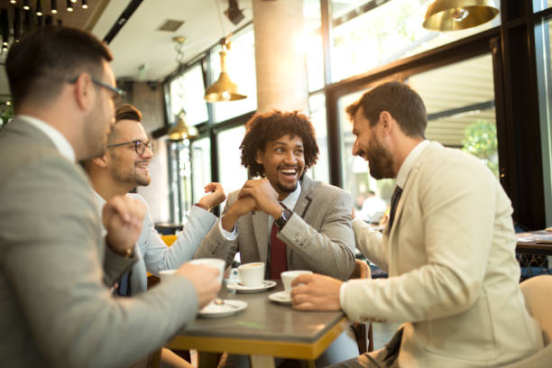 istock Funny conversation four businessmen while sit pub and drinking coffee after work 1195851058