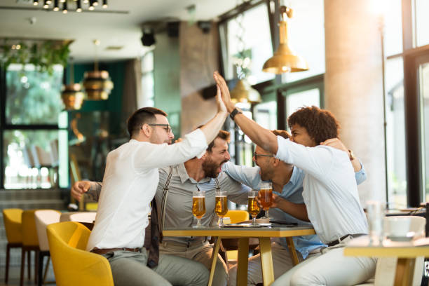 istock Celebrating good business cooperation at the bar 1195851724