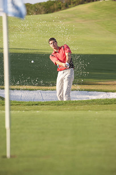 istock Male Golfer Playing Bunker Shot On Golf Course 119585410