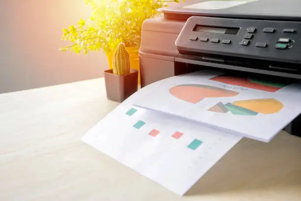 The printer is fully functional,Located on the desk. Is important in the office to present the work and success of the work.