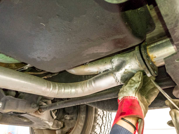 istock broken or leaked silencer of a vehicle 1195862627