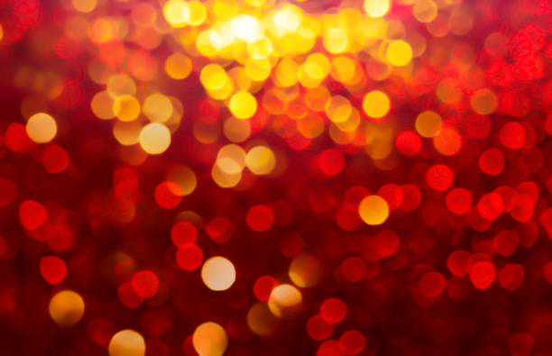 istock snow bokeh Backgrounds color red, gold tone blur bokeh light. 1195863479