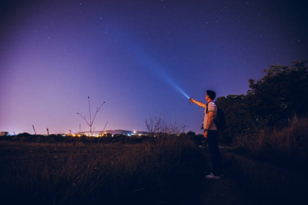 istock Man lighting up the stars 1195865084