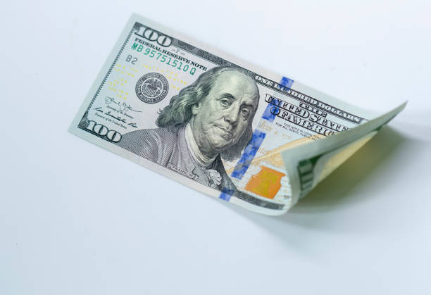 istock USD 100 dollars banknotes on isolated white background 1195866090