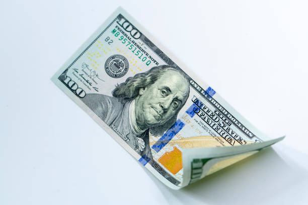 istock USD 100 dollars banknotes on isolated white background 1195866191