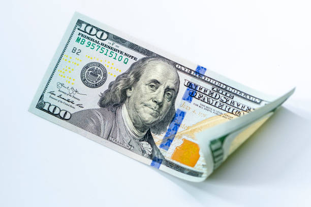 istock USD 100 dollars banknotes on isolated white background 1195866249
