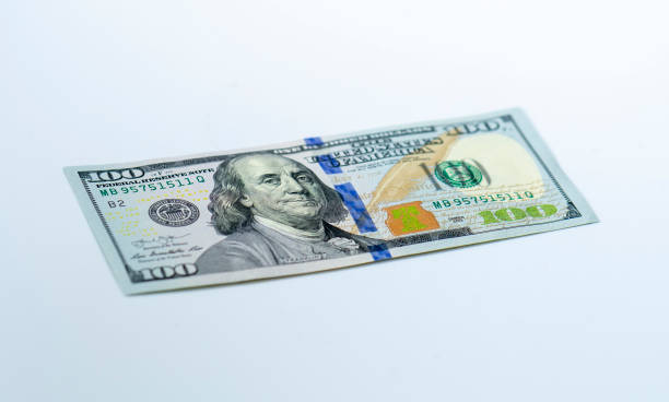istock USD 100 dollars banknotes on isolated white background 1195866315