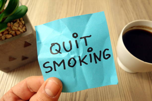 istock Quit smoking - motivational reminder handwritten on sticky note 1195869832