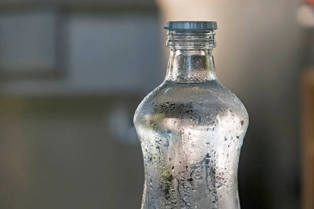 istock drinkable cold water in a glass bottle 1195870691