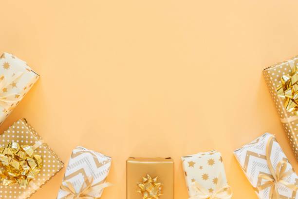 istock Holiday background with gold gift boxes 1195870743