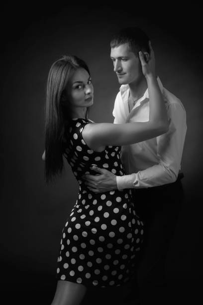 istock Couple in love dancing in the Studio. 1195872527