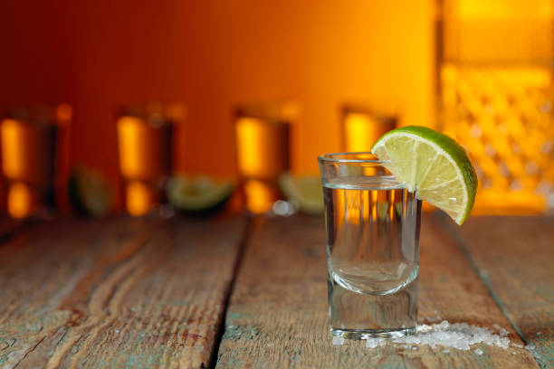 istock Tequila with  salt and lime on a old wooden background. 1195873398
