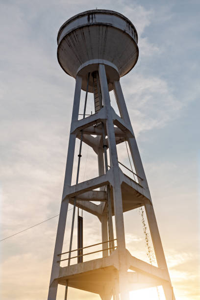 istock water supply tank. Water storage on sunset background. 1195873554